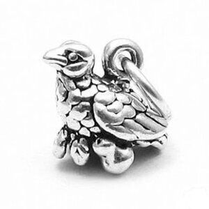 PARTRIDGE IN A PEAR TREE CHARM IN STERLING SILVER.